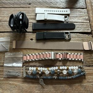 5 Replacement bands for a Fitbit versa/versa 2. Fitbit versa 2 charger.